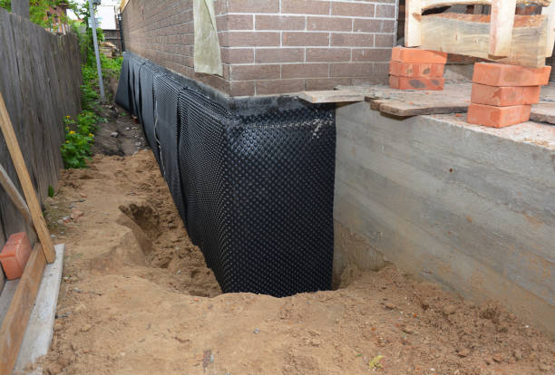 SJ Waterproofing Pros technician performing targeted Sump Pump Installation assessment in Eagan, TN